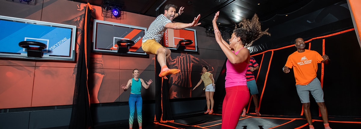 guests having fun jumping in skyzone onboard a carnival cruise ship